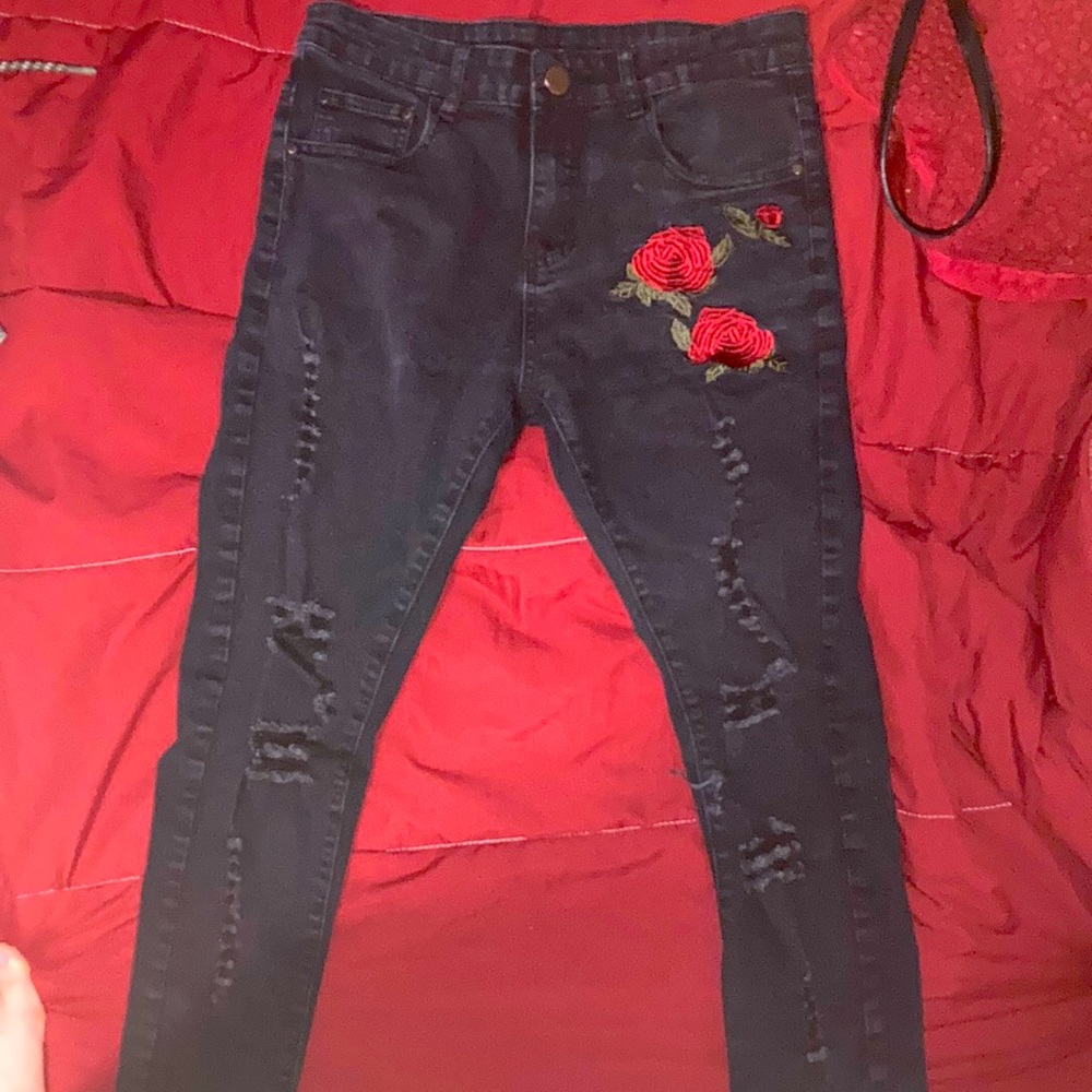 I am selling these black jeans with a red rose on them for $10!!
